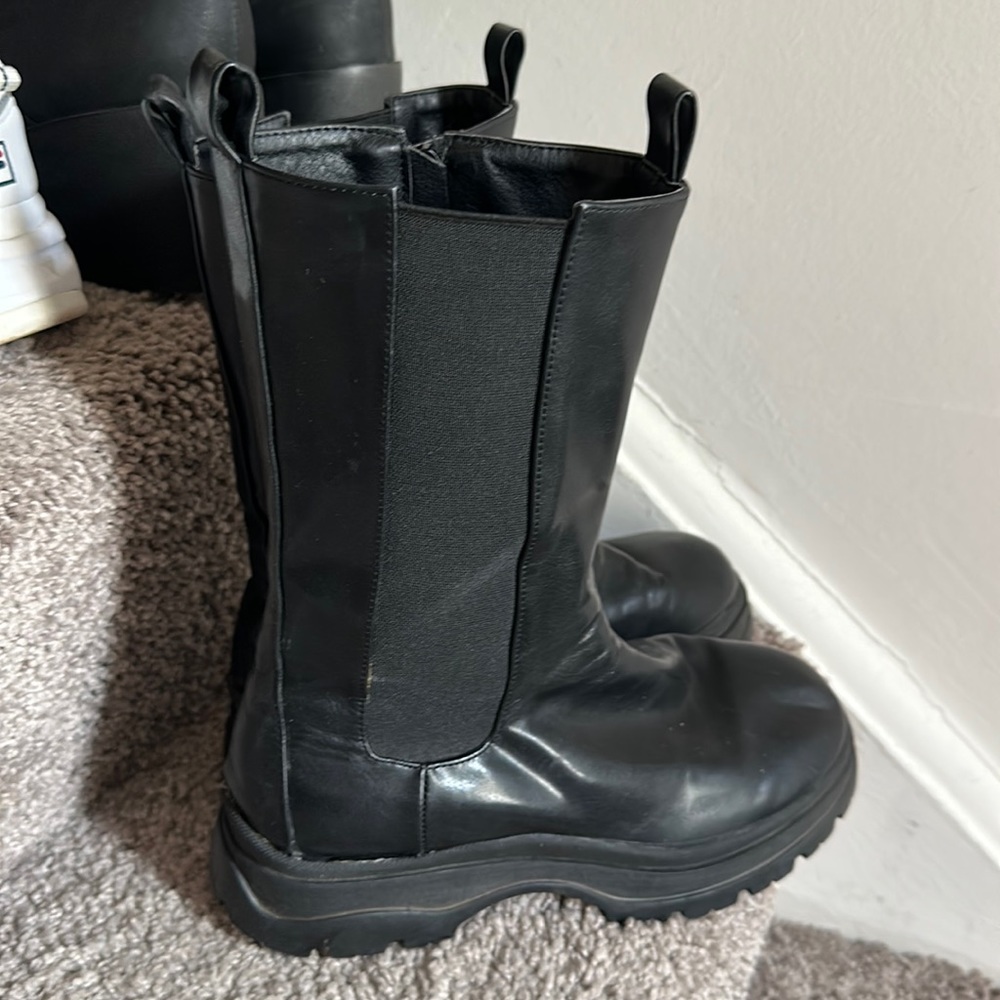 Its a boot and the length is up to calves. There is no brand for this.